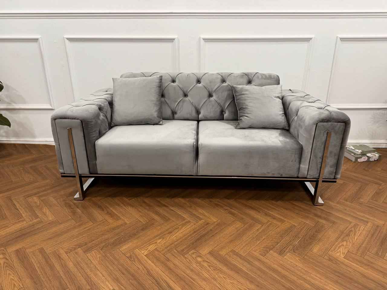 Q&P Furniture King Sofa Set featuring plush fabric upholstery, large seating area, and elegant design in a modern living room setting.