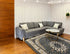 Q&P Furniture lavender corner sofa bed with storage, showcasing plush upholstery and a modern corner design in a living room setting.