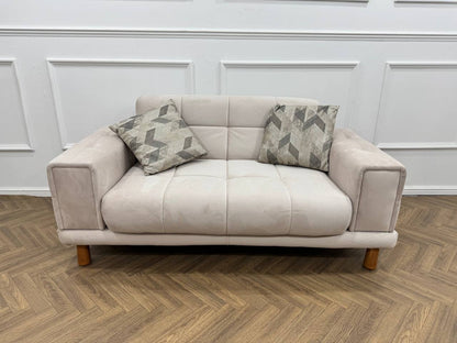 Q&amp;P Furniture Flora velvet sofa set with plush cushions and modern design, shown in a stylish living room setting.