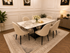Black Clara dining table set by Q&P Furniture with sleek design, featuring a sturdy table and matching chairs in a modern dining room setting.