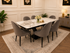 Black Clara dining table set by Q&P Furniture with sleek, modern design and matching chairs for contemporary dining spaces.
