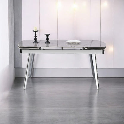 Enhance your dining experience with the Q&amp;P Furniture Grey Queen Dining Set. Spacious, stylish, and durable, this set is perfect for family dining and entertaining guests.