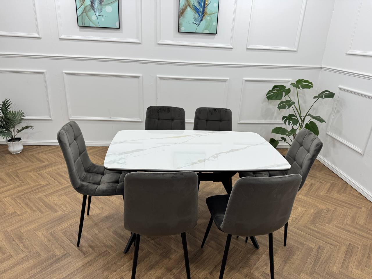 Q&amp;P Furniture Niva Dining Set with a modern dining table and matching chairs, featuring a sleek wood finish and contemporary design.