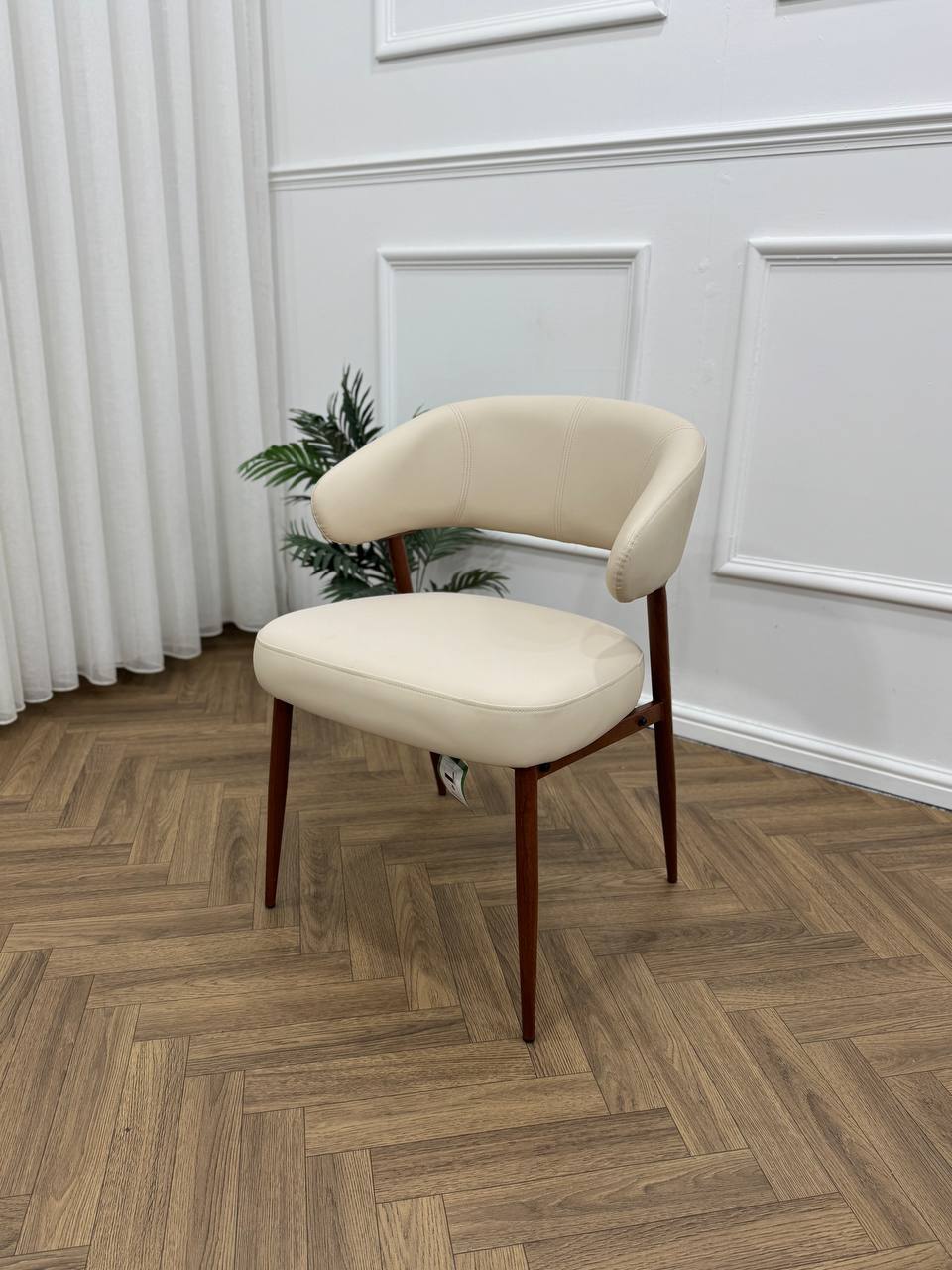 Q&amp;P Furniture Zino beige dining table with sleek wooden surface and modern design, shown in a well-lit dining room setting