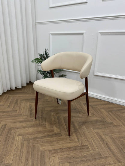 Q&amp;P Furniture Zino beige dining table with sleek wooden surface and modern design, shown in a well-lit dining room setting